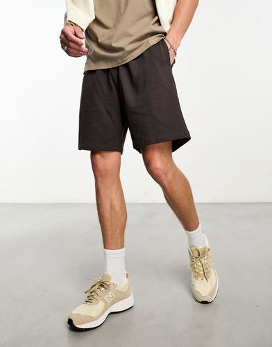 Pantaloncini slim in jersey di media lunghezza marrone - ASOS DESIGN - Modalova