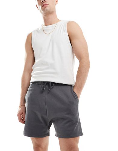 Pantaloncini slim taglio corto nero slavato - ASOS DESIGN - Modalova