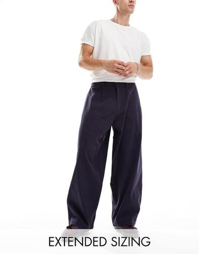 Pantaloni oversize a palloncino scuro a pieghe - ASOS DESIGN - Modalova