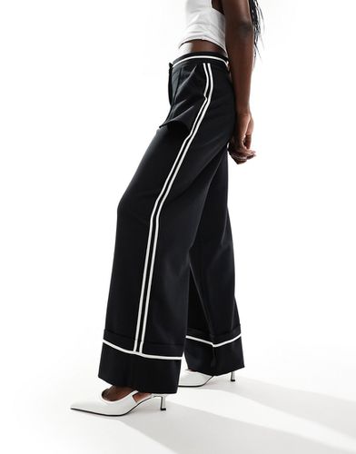 Pantaloni a fondo ampio neri con profili esterni - ASOS DESIGN - Modalova