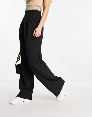 Pantaloni a fondo ampio neri - ASOS DESIGN - Modalova