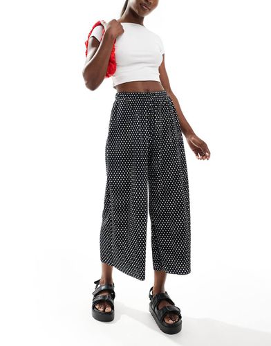 Pantaloni culotte a fondo ampio plissé a pois - ASOS DESIGN - Modalova