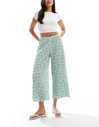 Pantaloni culotte ampi plissé verdi a fiorellini - ASOS DESIGN - Modalova