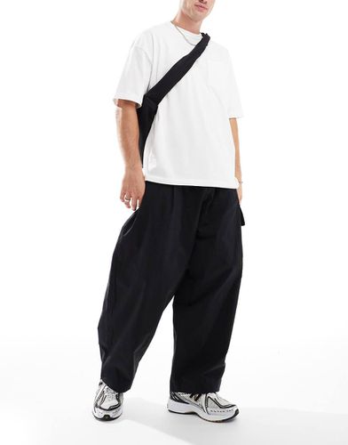 Pantaloni cargo a palloncino neri - ASOS DESIGN - Modalova