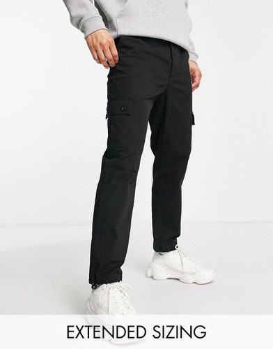 Pantaloni cargo affusolati neri con alamari - ASOS DESIGN - Modalova