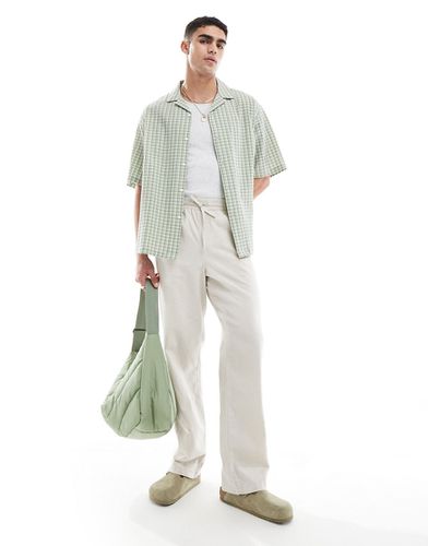 Pantaloni comodi in lino color pietra con elastico in vita - ASOS DESIGN - Modalova