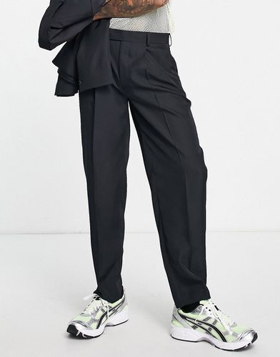 Pantaloni da abito oversize affusolati neri - ASOS DESIGN - Modalova
