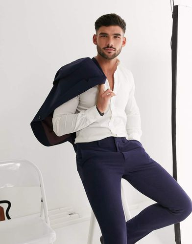 Pantaloni da abito super skinny elasticizzati in quattro direzioni - ASOS DESIGN - Modalova