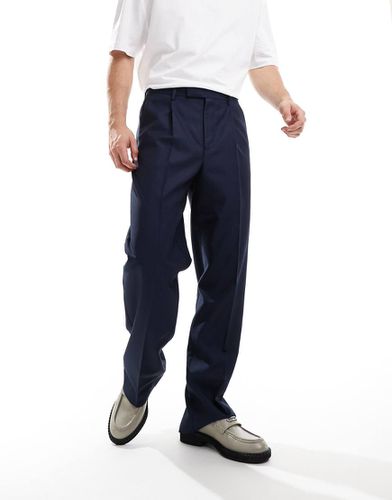 Pantaloni eleganti a fondo ampio con pieghe sul davanti blu navy - ASOS DESIGN - Modalova