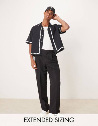 Pantaloni eleganti a fondo ampio neri a pieghe sul davanti - ASOS DESIGN - Modalova