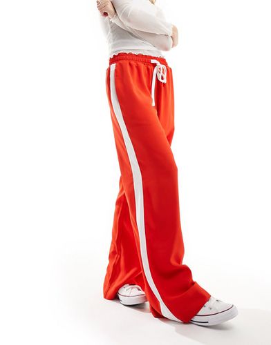 Pantaloni rossi con pannello a contrasto - ASOS DESIGN - Modalova