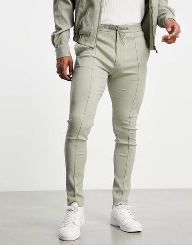 Pantaloni skinny eleganti con vita elasticizzata in tessuto stropicciato salvia - ASOS DESIGN - Modalova