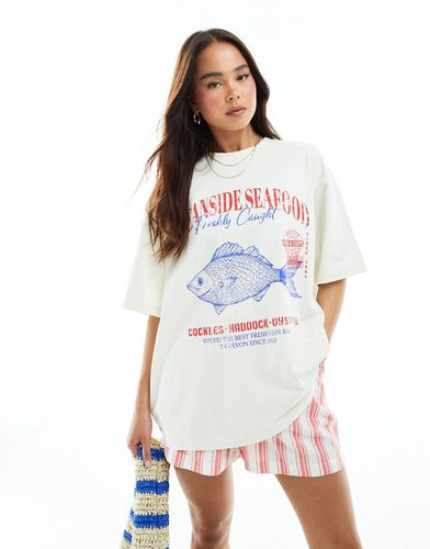 T-shirt boyfriend color crema con grafica marina "Oceanside" - ASOS DESIGN - Modalova