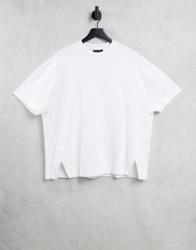 T-shirt comoda testurizzata con spacchetti laterali bianca - ASOS DESIGN - Modalova