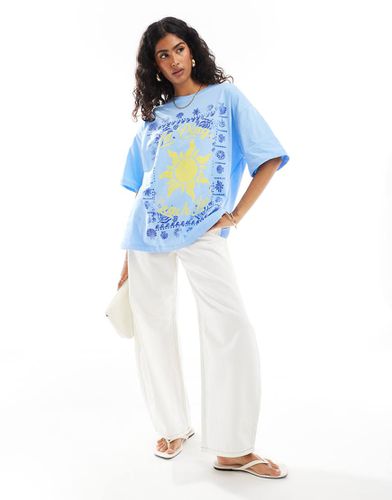 T-shirt oversize bianca con grafica "La Plage" - ASOS DESIGN - Modalova