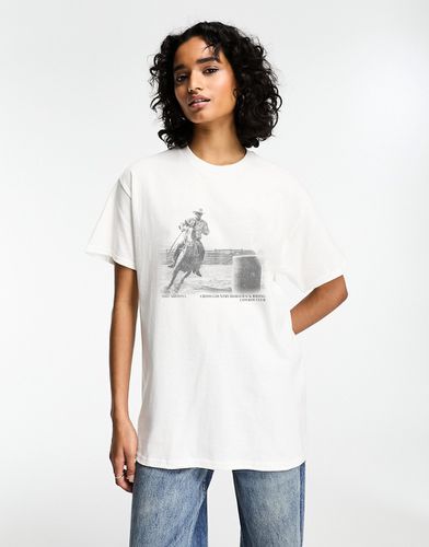 T-shirt oversize bianca con stampa grafica di cow boy a cavallo - ASOS DESIGN - Modalova