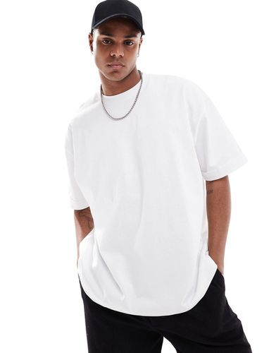 T-shirt oversize pesante bianca con risvolto sulle maniche - ASOS DESIGN - Modalova