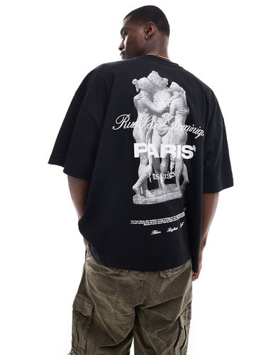 T-shirt super oversize nera con stampa di statue e scritta "Paris" sulla schiena - ASOS DESIGN - Modalova