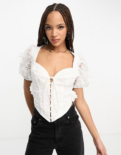 Top a corsetto con maniche a sbuffo in pizzo floreale 3D - ASOS DESIGN - Modalova