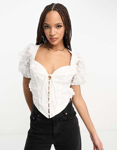 Top a corsetto con maniche a sbuffo in pizzo floreale 3D - ASOS DESIGN - Modalova