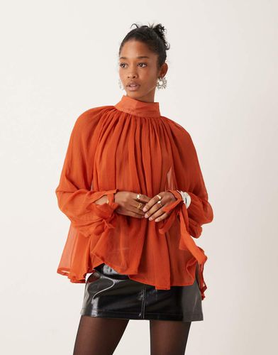 Top accollato trasparente color ruggine con polsini allacciati - ASOS DESIGN - Modalova