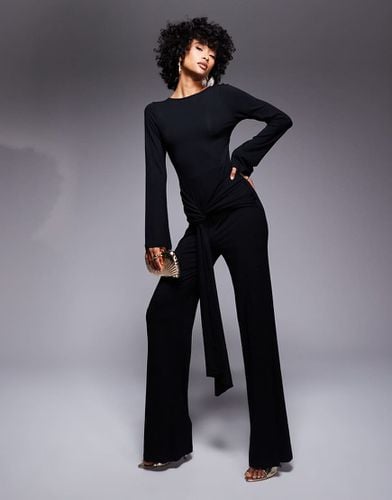 Tuta jumpsuit a maniche lunghe nera con schiena scoperta e fascia in vita - ASOS DESIGN - Modalova