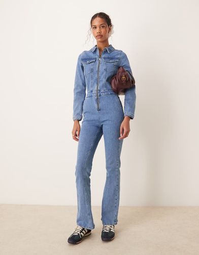 Tuta jumpsuit a maniche lunghe in denim medio - ASOS DESIGN - Modalova