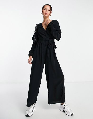 Tuta jumpsuit allacciata a portafoglio nera - ASOS DESIGN - Modalova