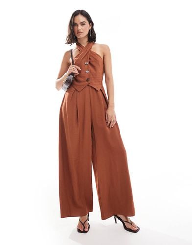 Tuta jumpsuit con incrocio sullo scollo e bottoni - ASOS DESIGN - Modalova