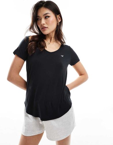 T-shirt nera con scollo a V e logo - Hollister - Modalova