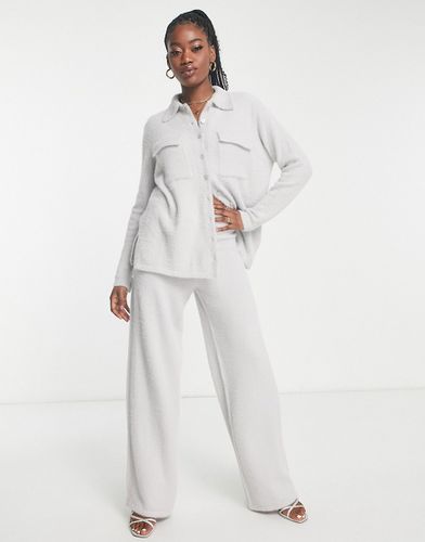Pantaloni a fondo ampio grigi in maglia in coordinato - In The Style - Modalova
