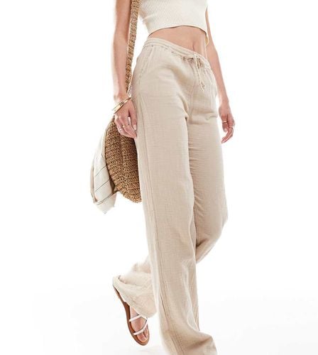 Pantaloni a fondo ampio in mussola beige - ONLY Tall - Modalova