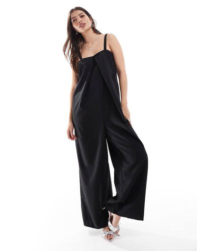 Tuta jumpsuit nera con fondo ampio e dettaglio a pieghe - ONLY - Modalova