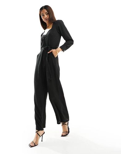 Tuta jumpsuit nera glitterata con scollo a V allacciata in vita - ONLY - Modalova