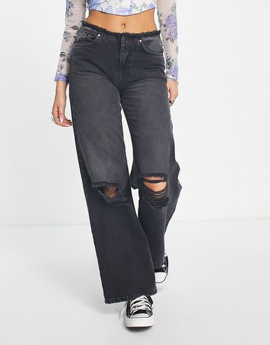 Jeans a fondo ampio con vita bassa sfrangiata neri - ONLY - Modalova