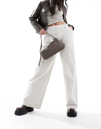 Pantaloni a vita alta a fondo ampio color pietra con pieghe - ONLY - Modalova