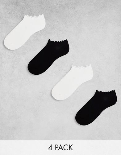 Confezione da 4 paia di calzini sportivi bianchi e neri con orlo smerlato - Lindex - Modalova