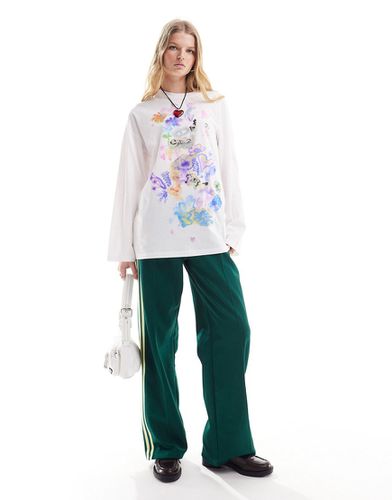 T-shirt oversize a maniche lunghe bianca con stampa con cuori e fiori - Monki - Modalova