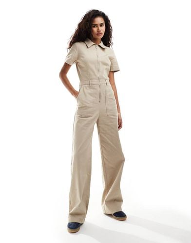 Tuta jumpsuit a fondo ampio con zip davanti beige - Monki - Modalova