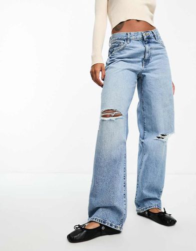 Jeans comodi a vita bassa medio con strappi - Mango - Modalova