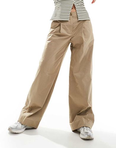 Pantaloni extra larghi dritti beige con bottoni sul davanti - Mango - Modalova