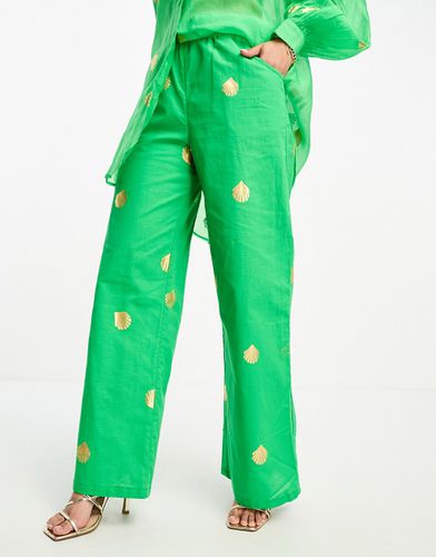 Pantaloni a fondo ampio verdi con conchiglie metallizzate in coordinato - Never Fully Dressed - Modalova