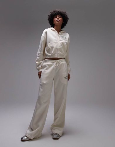 Pantalon de jogging large en molleton - Beige - New Balance - Modalova