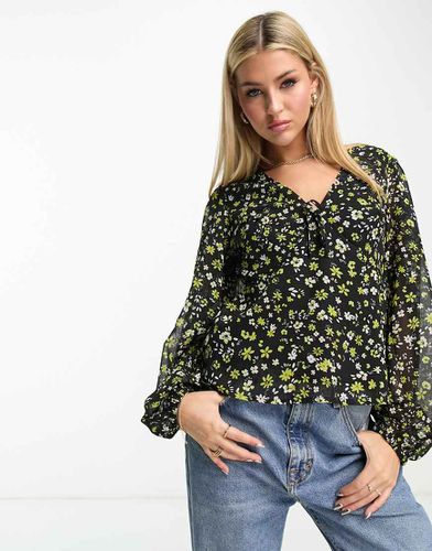 Blusa corta a maniche lunghe nera a fiori - New Look - Modalova