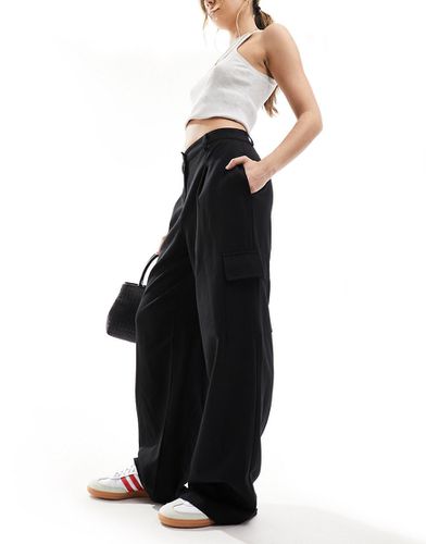 Pantaloni cargo con fondo ampio neri - New Look - Modalova