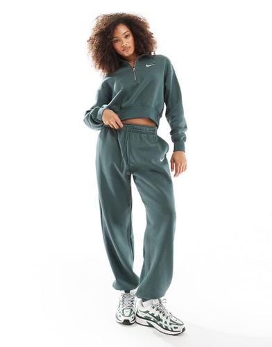 Phoenix Fleece - Joggers in pile verdi - Nike - Modalova