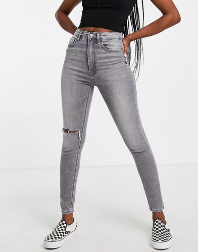 Jeans skinny a vita super alta grigi con strappi - Stradivarius - Modalova