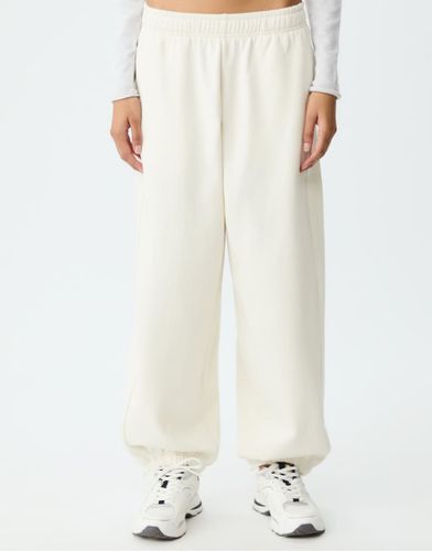 Pantalon de jogging à liseré - Écru - Stradivarius - Modalova