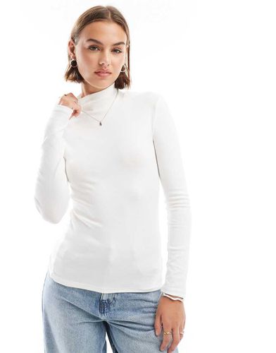 Top a maniche lunghe con collo alto - Stradivarius - Modalova