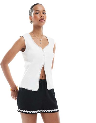 Top sans manches boutonné en tissu côtelé avec détails en dentelle - Pieces - Modalova